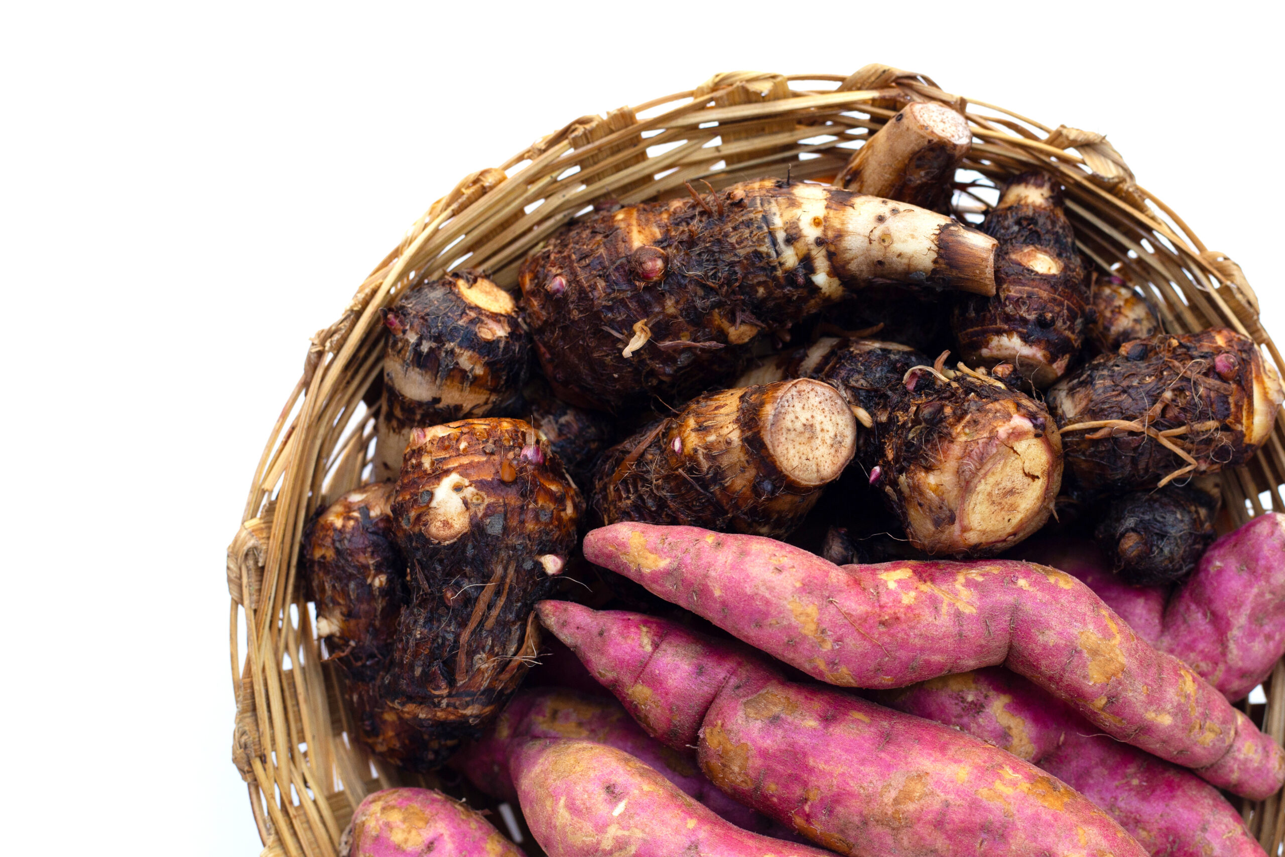 Sweet potato with taro in bamboo basket on white background